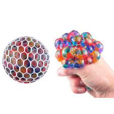 A collage of two images: on the left, a hand tightly squeezes a yellow smiley face stress ball, while on the right, alongside a mesh stress ball filled with silica gel, another hand squishes a second similar mesh stress ball.